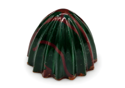 Glossy, ribbed dome-shaped mint chocolates in emerald green brushed with bronze-copper streaks